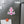Pink anchor-shaped magnet with a light pink printed bow, white border and navy script