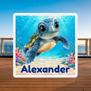 Square personalized cruise door magnet with a blue baby sea turtle, underwater coral scene