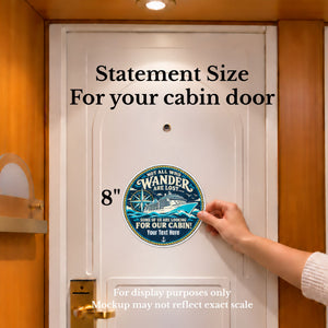 Round navy and teal cruise door magnet with a ship, compass and gold rope border. Text reads “Not all who wander are lost… some of us are looking for our cabin!”
