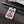 Cruise Squad acrylic luggage tag with navy anchor, red and gold stars, colourful streamers, and adjustable black leather strap
