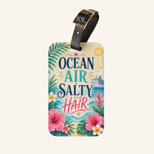 Ocean Air Salty Hair cruise luggage tag with tropical flowers, ocean waves, cruise ship artwork, and black leather strap