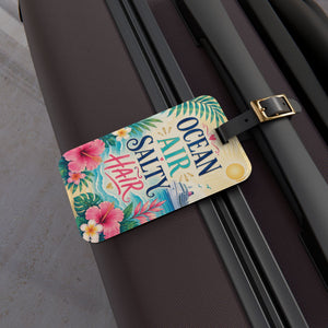 Ocean Air Salty Hair cruise luggage tag with tropical flowers, ocean waves, cruise ship artwork, and black leather strap