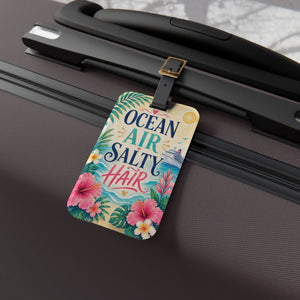 Ocean Air Salty Hair cruise luggage tag with tropical flowers, ocean waves, cruise ship artwork, and black leather strap