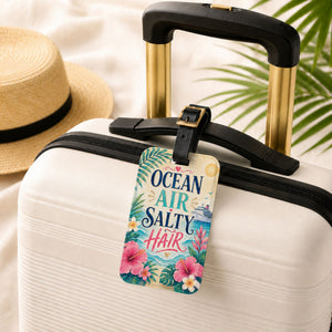 Ocean Air Salty Hair cruise luggage tag with tropical flowers, ocean waves, cruise ship artwork, and black leather strap