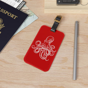 Red Octopus Cruise luggage tag with white vintage octopus artwork and adjustable black leather strap.