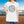 Drink Package Club cruise T-shirt with white circular badge lettering, stars, gold anchors, and colourful cocktail graphics.