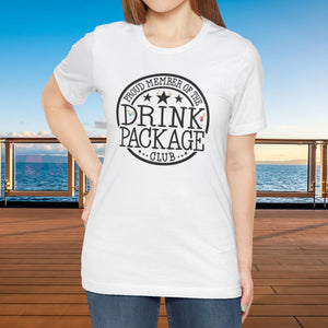 Drink Package Club cruise T-shirt with white circular badge lettering, stars, gold anchors, and colourful cocktail graphics.