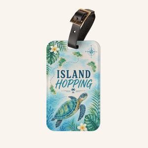 Island Hopping cruise luggage tag with sea turtle, tropical islands, flowers, palm leaves, and black strap