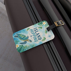 Island Hopping cruise luggage tag with sea turtle, tropical islands, flowers, palm leaves, and black strap